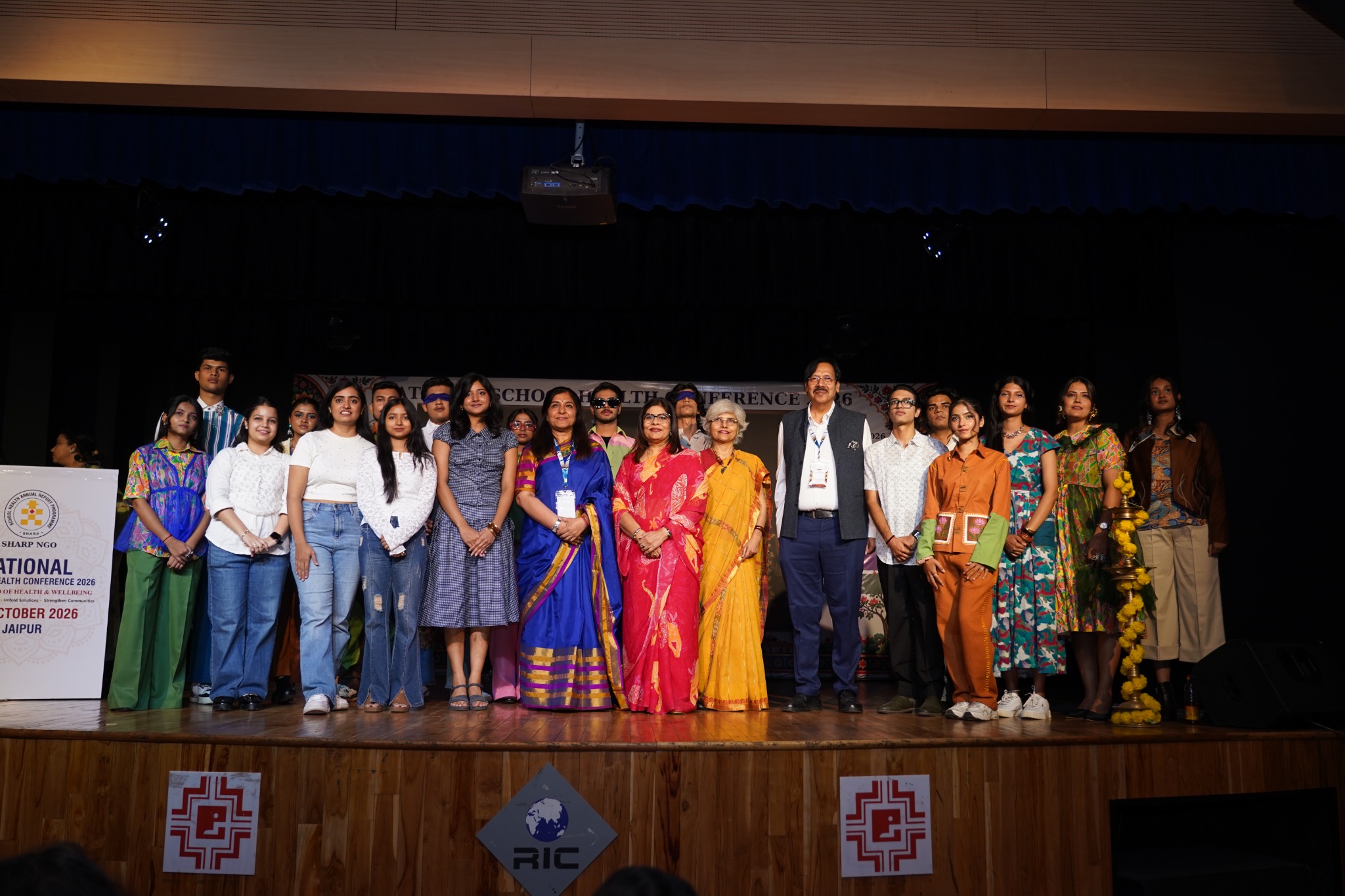 Students of ARCH College of Design & Business join guests for a group photograph following the mental health-themed fashion show.